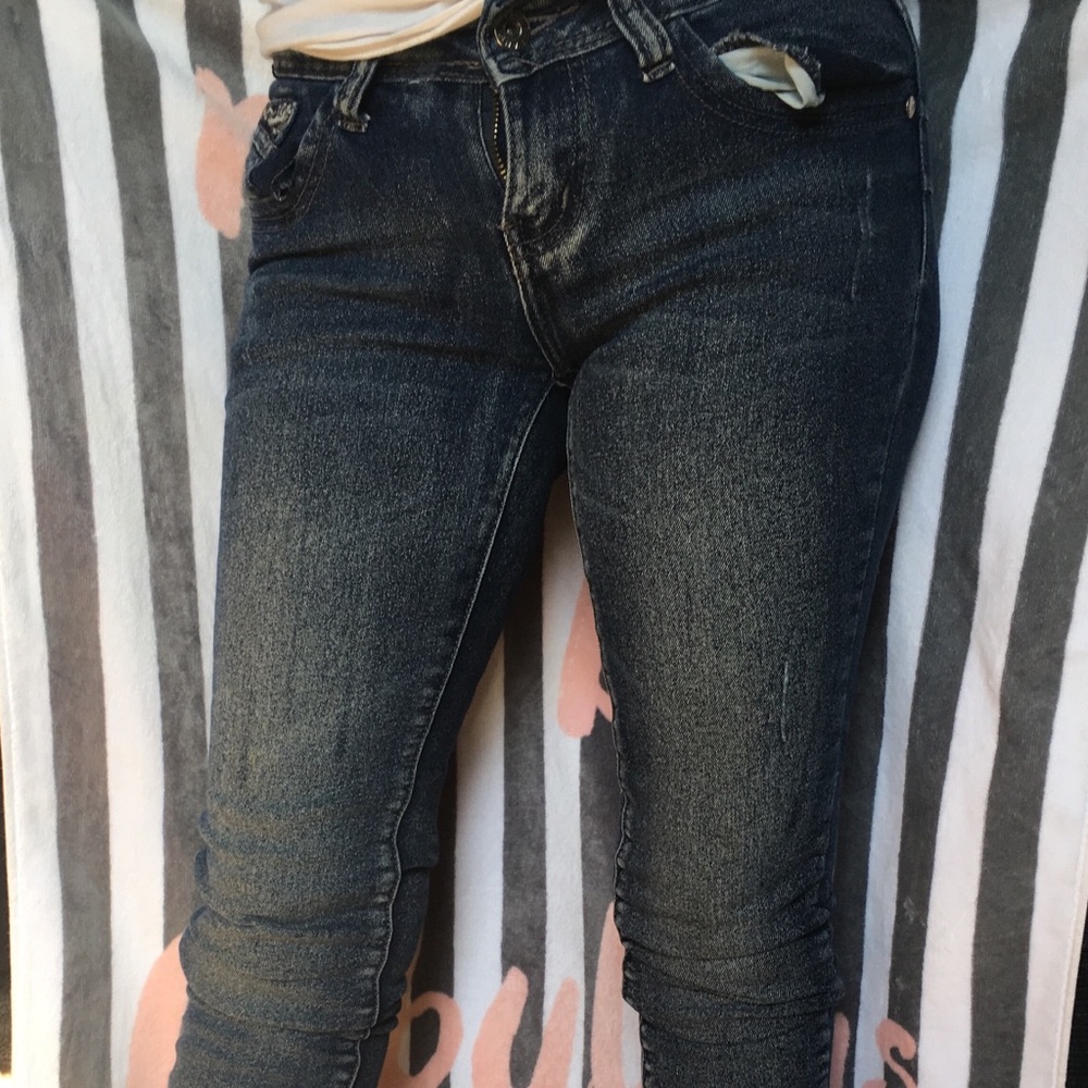 Faded Blue Jeans w/sparkle embroidered design.